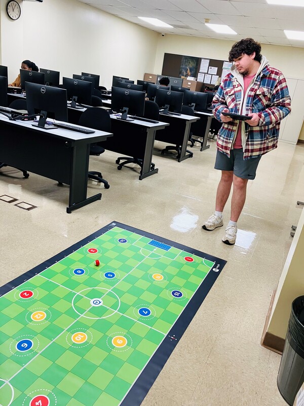 Student demonstrates fun, new technology now in use in the Information Systems program   